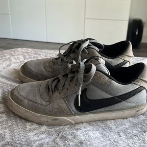 Nike grey suede low tops with black accents